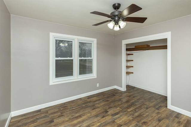 unfurnished bedroom featuring ceiling fan, dark hardwood / wood-style flooring, and a closet