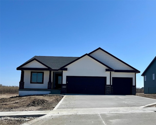 view of front facade featuring an attached garage and concrete driveway
