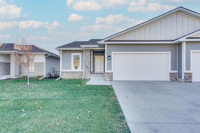 view of front of home featuring a garage and a front lawn