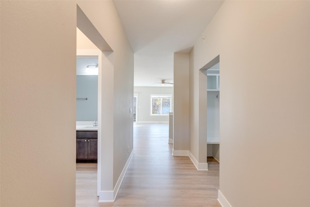 hall with light wood-type flooring