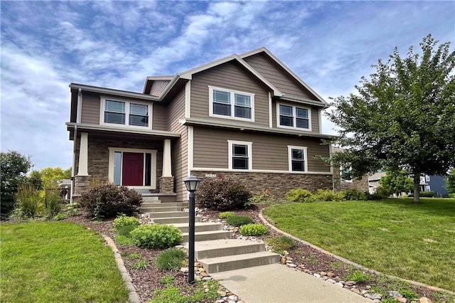 craftsman-style house with a front lawn