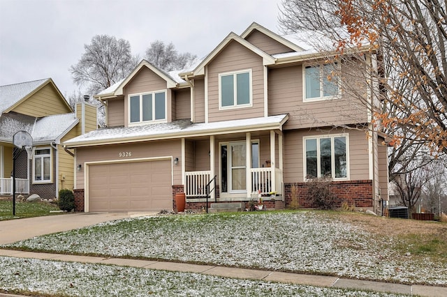 craftsman house with a porch and a garage