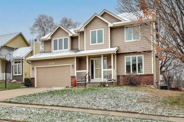 craftsman inspired home featuring brick siding, driveway, and an attached garage