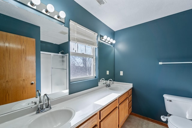 full bathroom with a shower with door, tile patterned flooring, toilet, and a sink