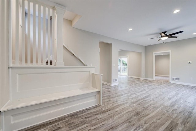 interior space with hardwood / wood-style floors and ceiling fan