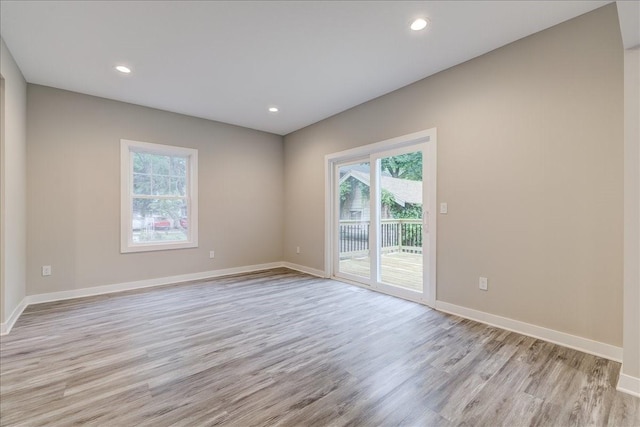 spare room featuring light hardwood / wood-style flooring