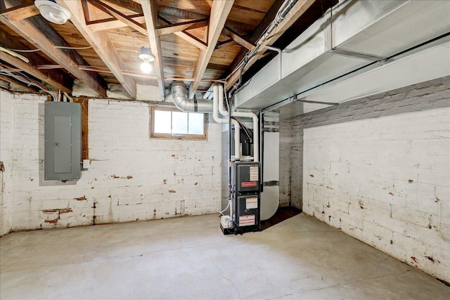 basement with electric panel and heating unit