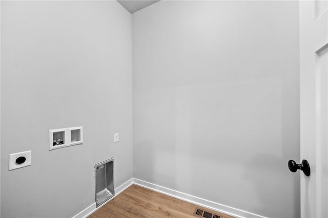 laundry area with hardwood / wood-style floors, electric dryer hookup, and hookup for a washing machine