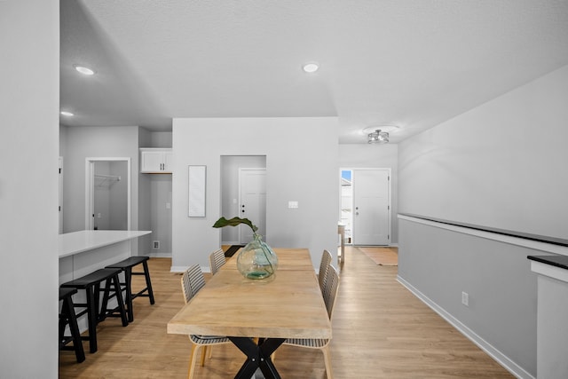 dining room with light hardwood / wood-style flooring