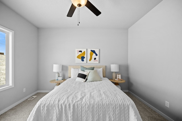 bedroom with ceiling fan and carpet floors