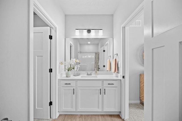 bathroom featuring vanity and walk in shower