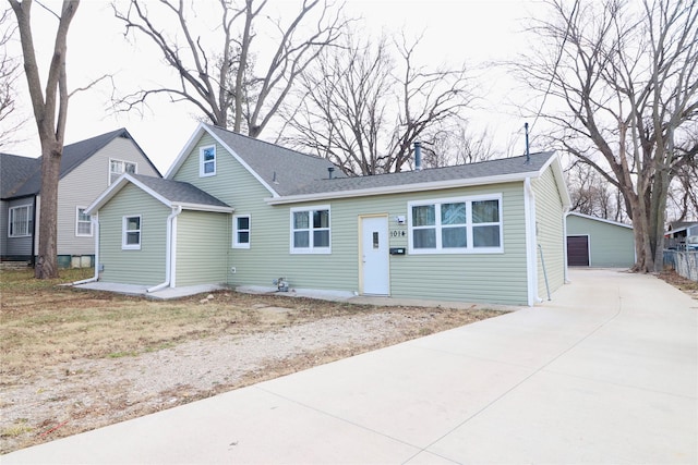 view of front of house with an outdoor structure and a garage