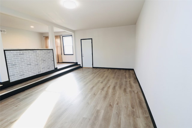 spare room with light wood-type flooring