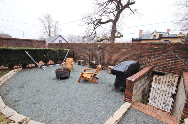 view of patio / terrace featuring a fire pit and grilling area