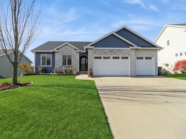 view of front facade with a front yard and a garage