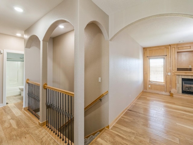 hall with light hardwood / wood-style flooring