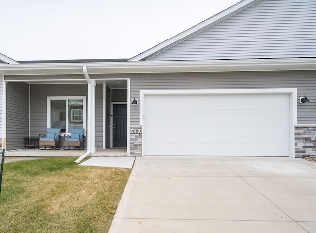 view of front of home with a porch and a garage