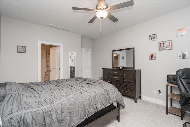 bedroom with ceiling fan and light colored carpet