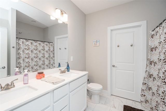 bathroom with vanity, a shower with shower curtain, and toilet