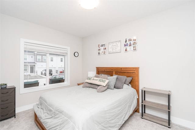 bedroom with light colored carpet