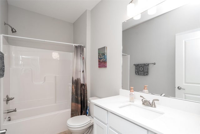 full bathroom featuring vanity, shower / tub combo, and toilet