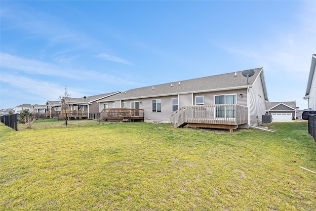 2818 NW 44th St, Ankeny, IA 50023 - back of house with a lawn, a wooden deck, and central AC
