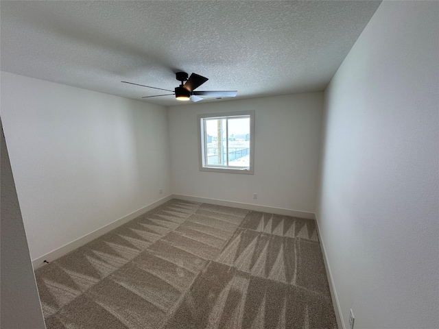 unfurnished room with light carpet, ceiling fan, and baseboards