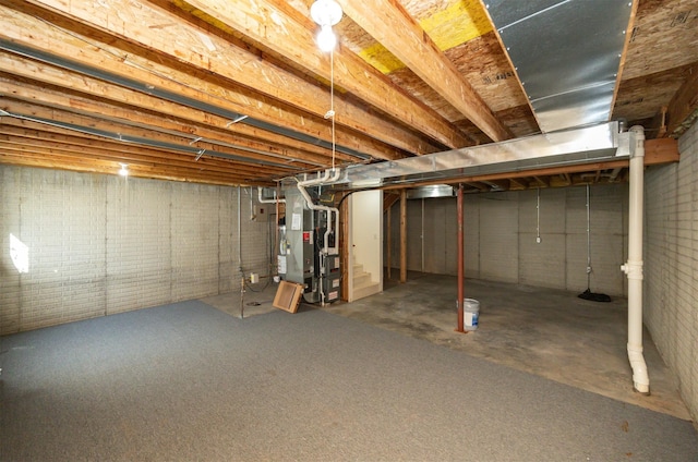 unfinished below grade area featuring heating unit