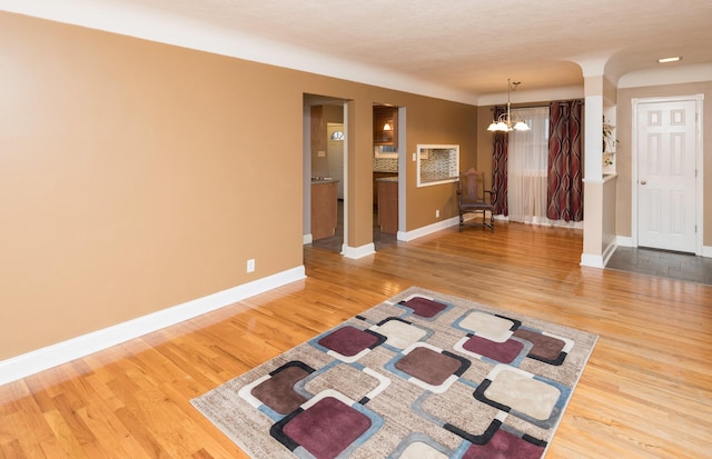 interior space featuring a notable chandelier and hardwood / wood-style flooring