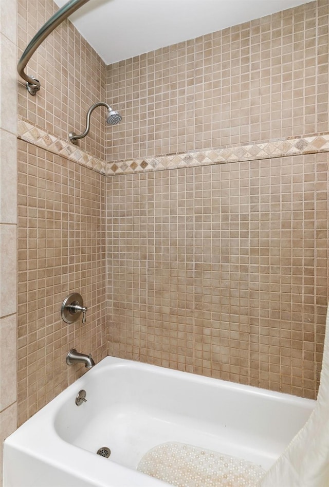 bathroom featuring shower / bathtub combination with curtain