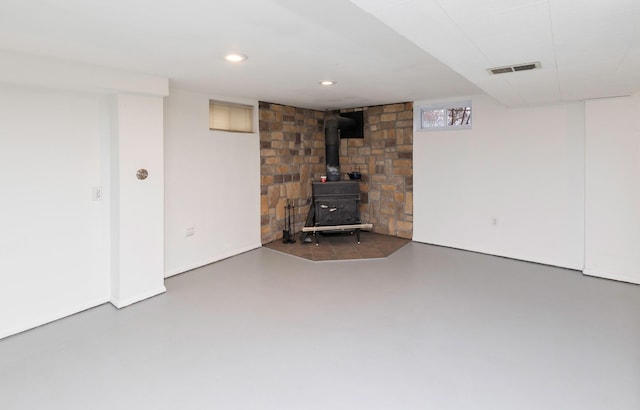 basement featuring a wood stove