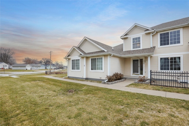 view of front of property with a yard