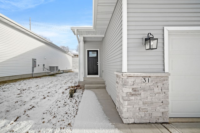 property entrance featuring central AC unit