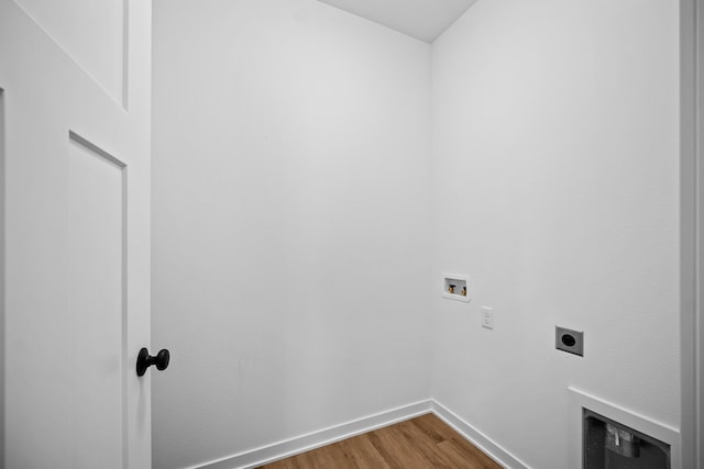 clothes washing area featuring hookup for a washing machine, hardwood / wood-style floors, and hookup for an electric dryer