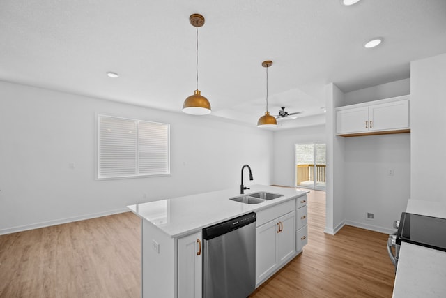 kitchen featuring white cabinets, stainless steel dishwasher, hanging light fixtures, and sink