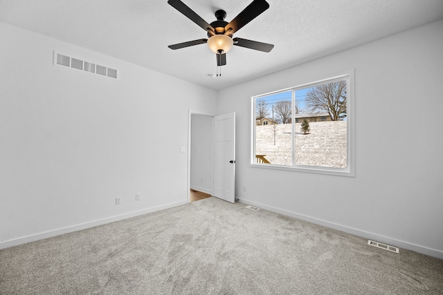 carpeted empty room with ceiling fan