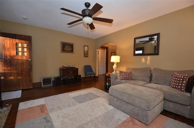 living room with ceiling fan and hardwood / wood-style floors