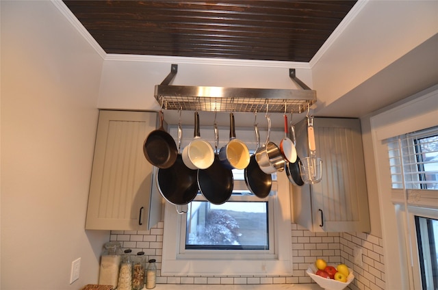 details with decorative backsplash, crown molding, and wood ceiling