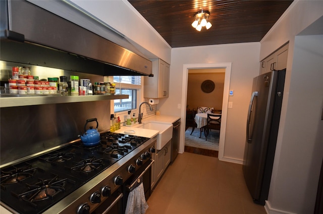 kitchen with stainless steel fridge, wood ceiling, cooktop, sink, and range hood