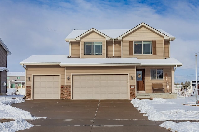 view of front of property with covered porch and a garage