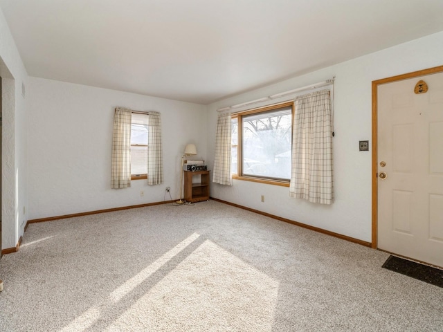 entrance foyer featuring carpet floors