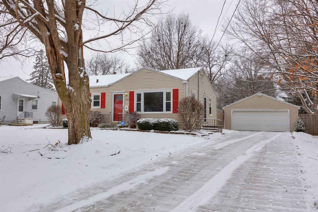 view of front of house featuring a garage and an outdoor structure