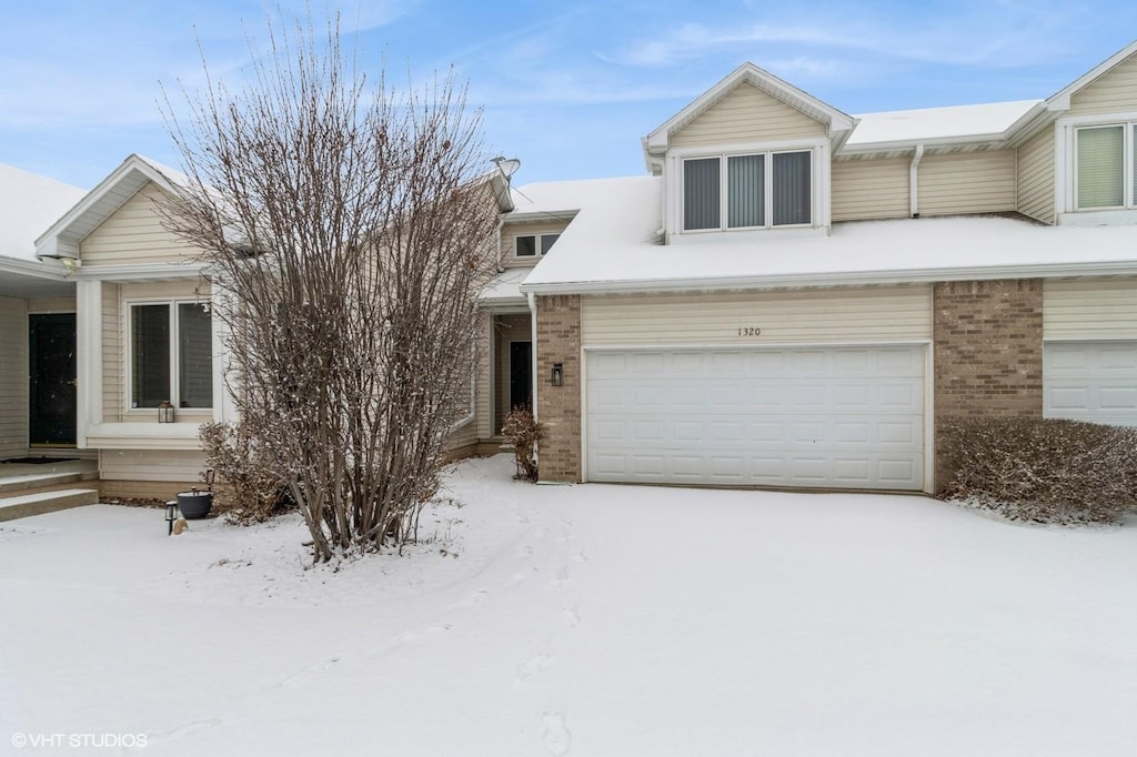 multi unit property featuring a garage