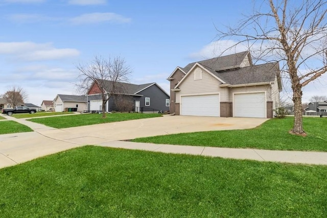 view of front of property with a garage and a front lawn