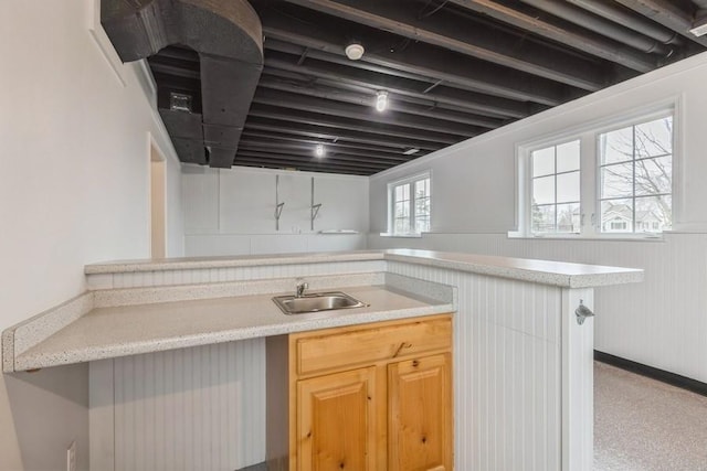 kitchen with sink and light brown cabinets