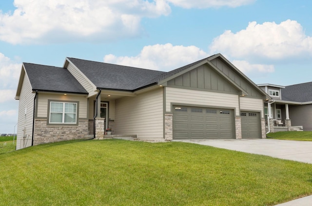 craftsman-style home featuring a garage and a front yard