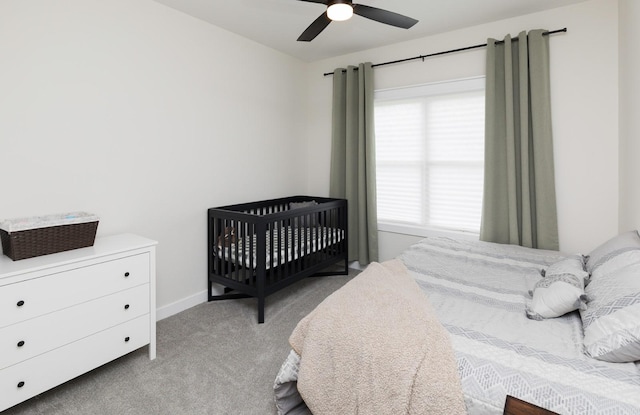 bedroom featuring ceiling fan and light carpet