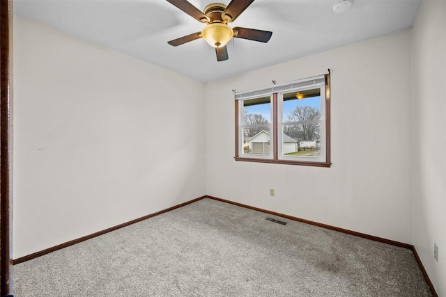 carpeted empty room with ceiling fan