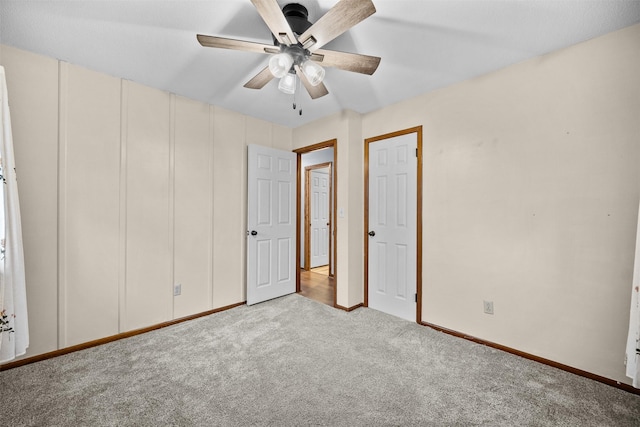 unfurnished bedroom featuring light colored carpet and ceiling fan