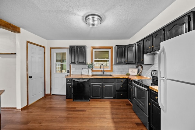 kitchen featuring sink, dishwasher, backsplash, electric range, and white refrigerator